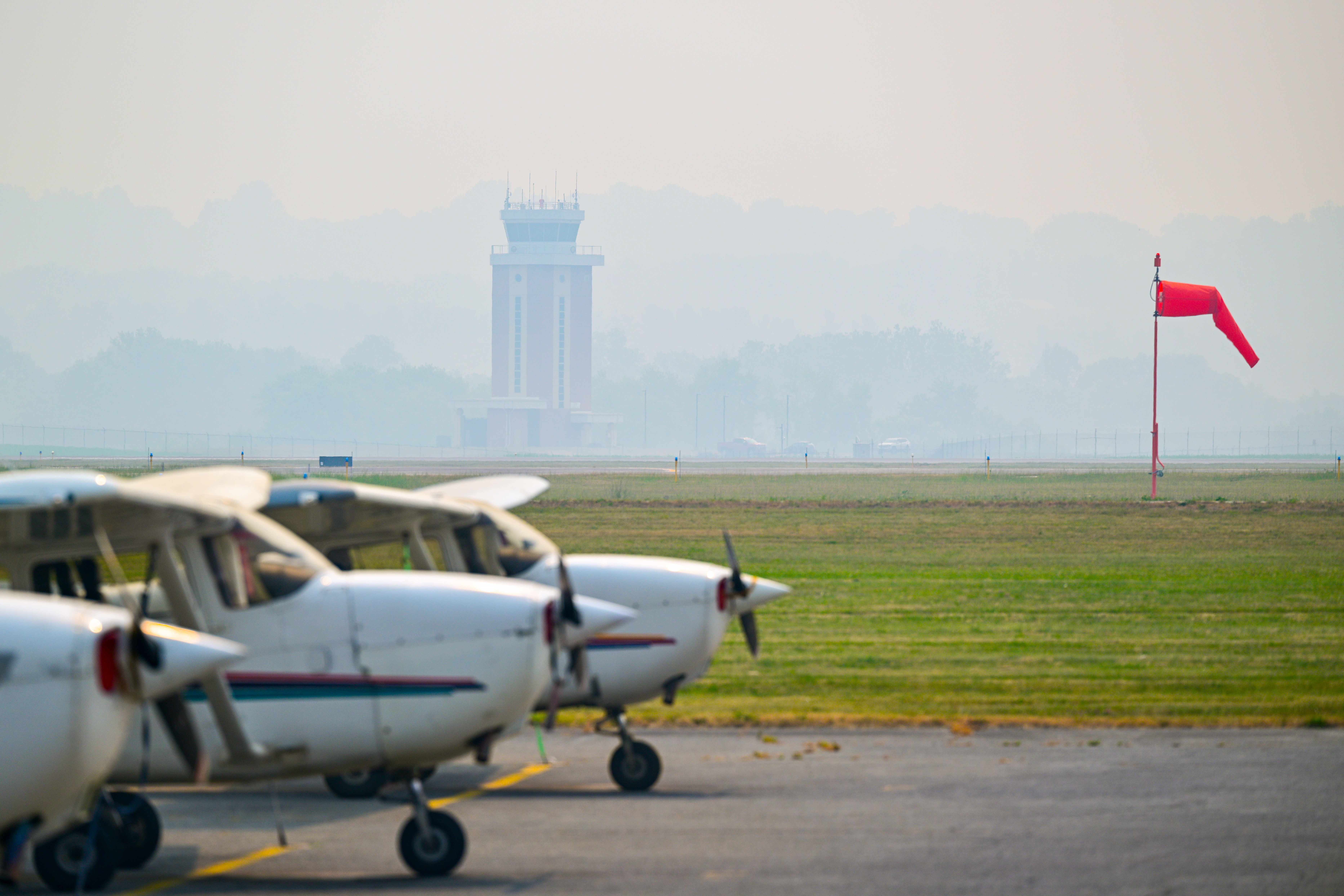 Smoky haze from Canadian wildfires descends on Frederick Municipal Airport to make flying conditions marginal for VFR pilots in Frederick, Maryland, June 10, 2023. The smoke can produce instrument meteorological conditions without much warning.  Photo by David Tulis.