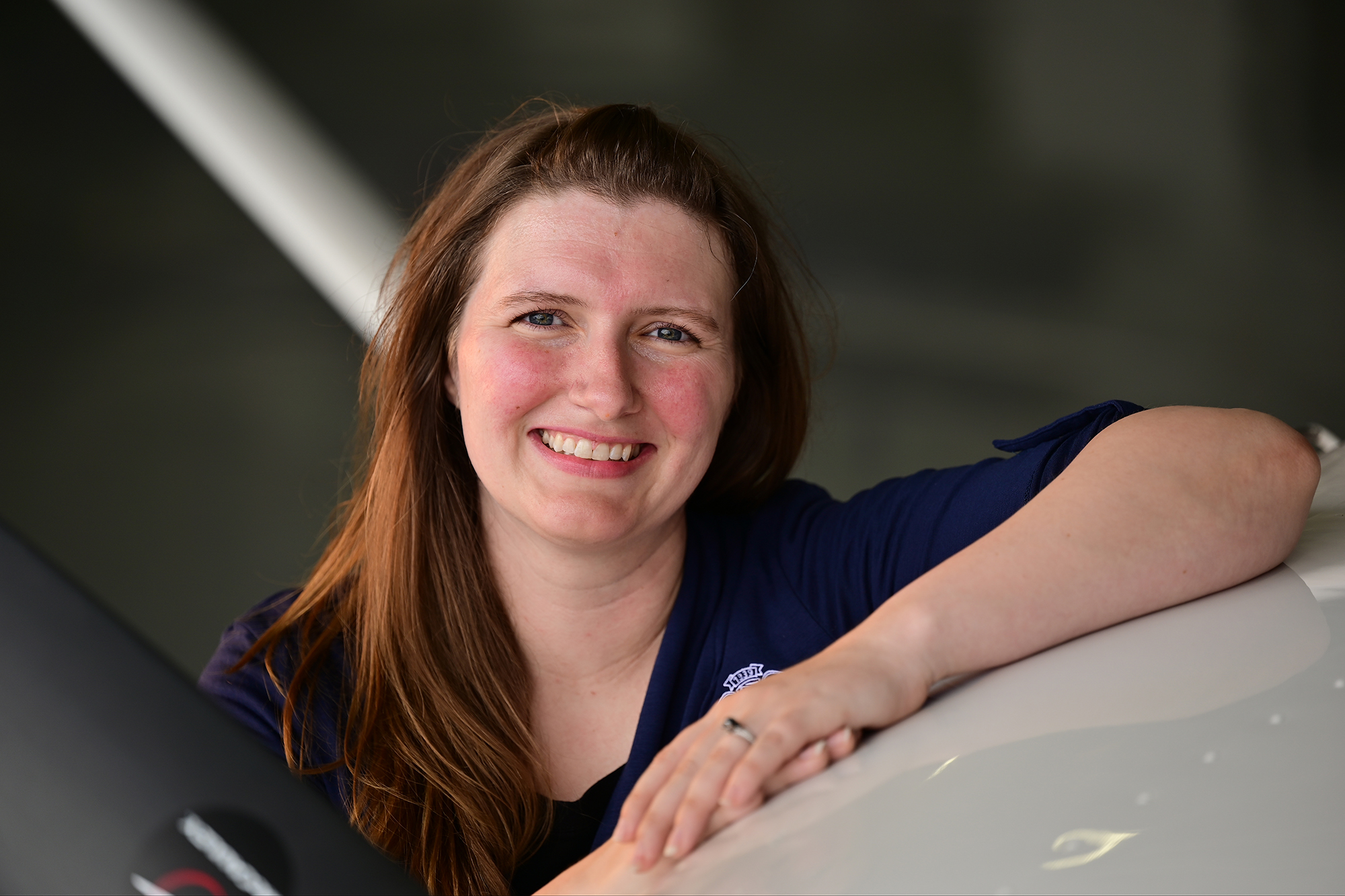 AOPA Paralegal Specialist Amy Jenkins poses for a photo at Frederick Municipal Airport in Frederick, Maryland, May 4, 2022. Photo by David Tulis.